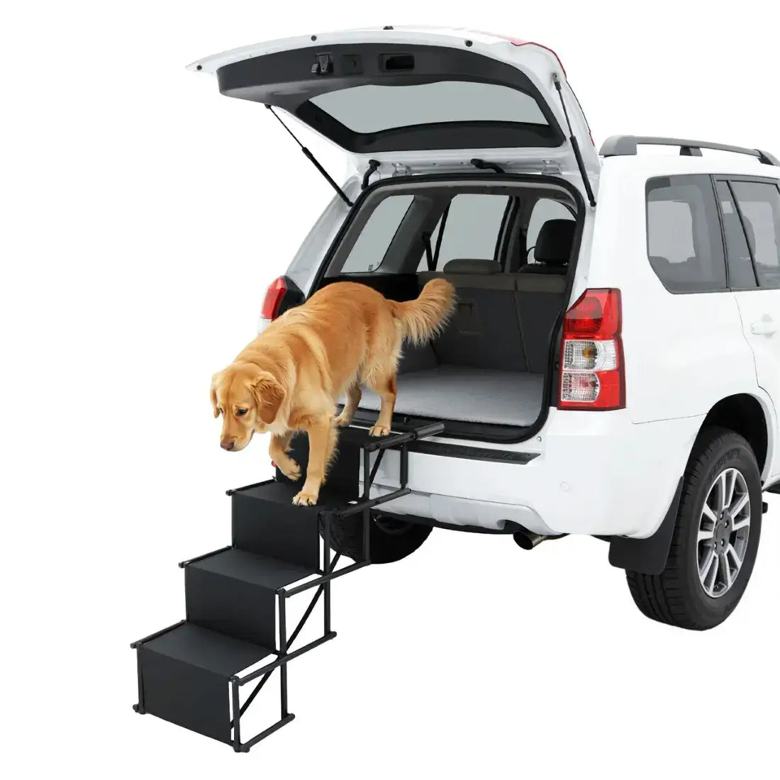 A black metal and carpeted three-step dog lift is shown attached to the open rear hatch of a white SUV, with a golden retriever standing on the steps to enter the vehicle. The photo is taken on a clean white studio background.