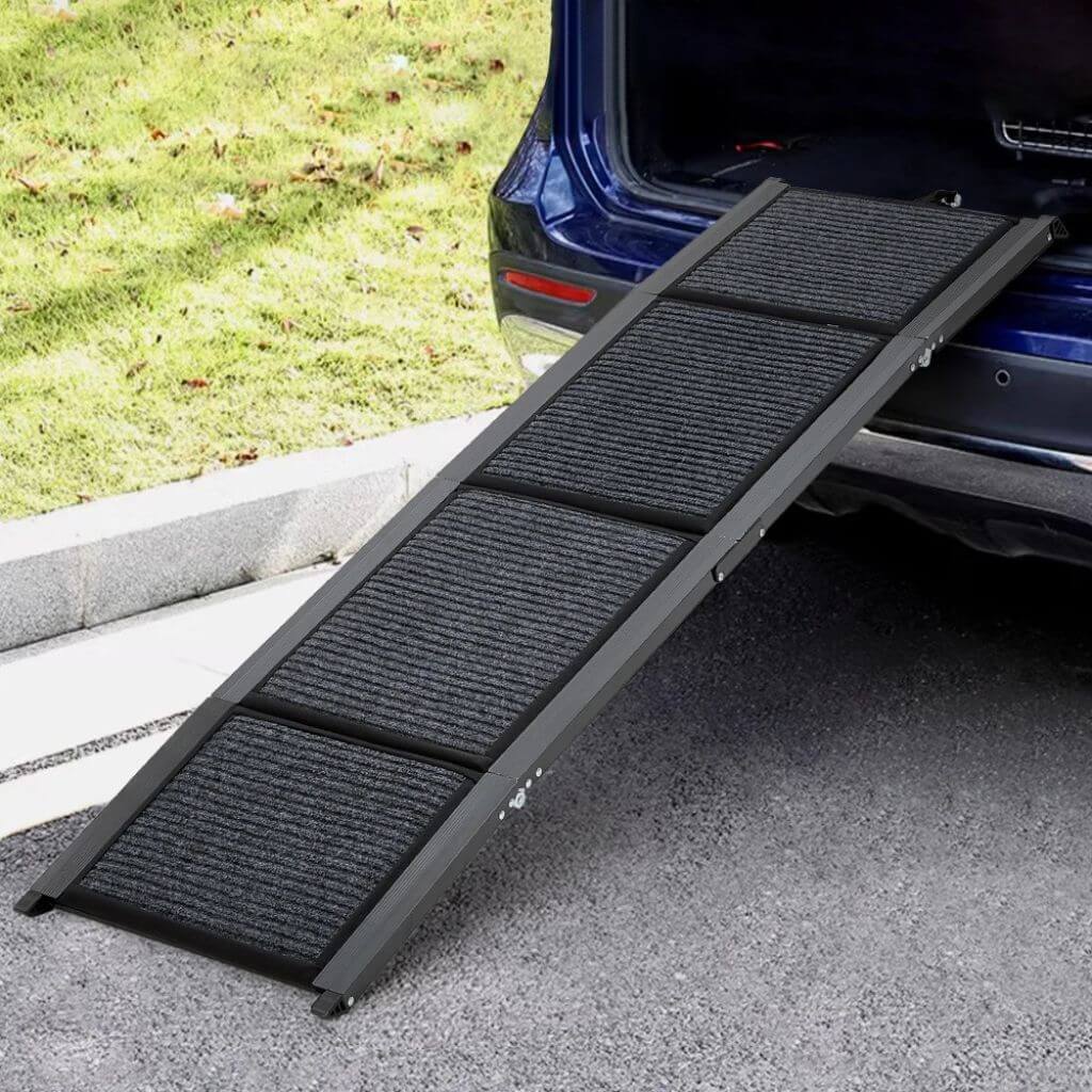 Black pet ramp leading from a car to grass