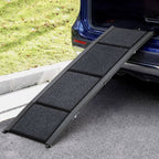 Black pet ramp leading from a car to grass