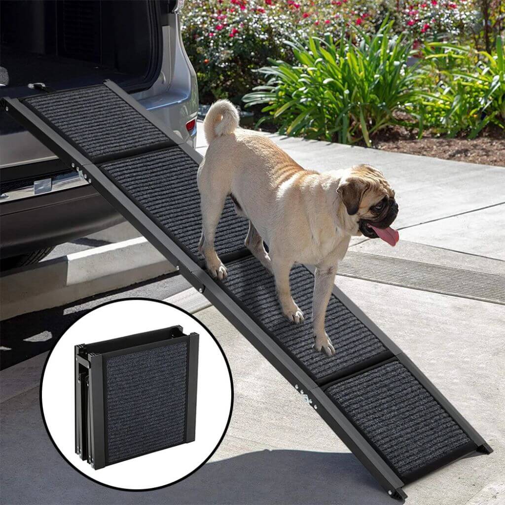 Dog using a black pet ramp to get into a vehicle with a close-up of the ramp's textured surface.