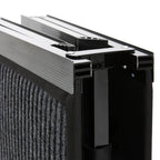 Close-up of a black dog ramp with ribbed metal surface on a white background